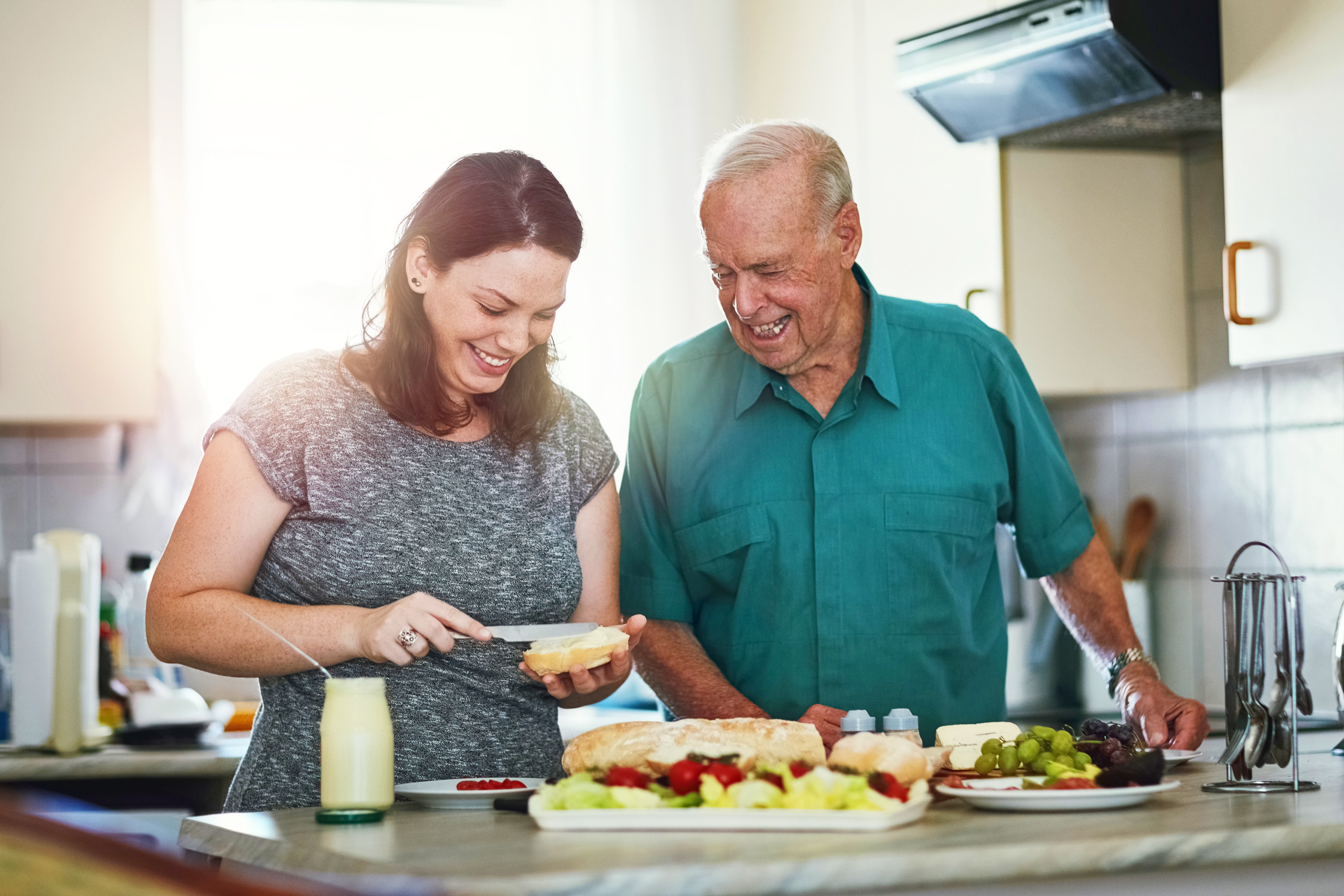 Father and daughter making a healthy lunch to enjoy together