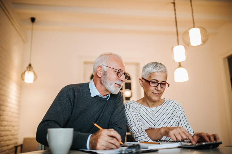 senior couple going over legal documents for loved one with long term memory loss