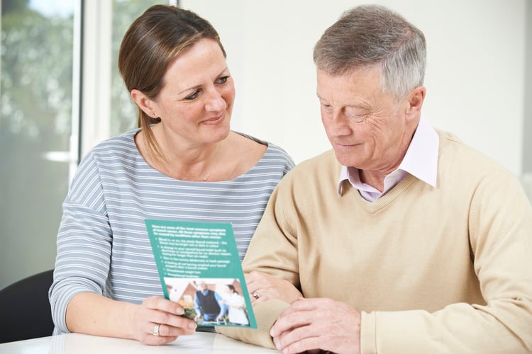 daughter talking with her dad about assisted living facilities 