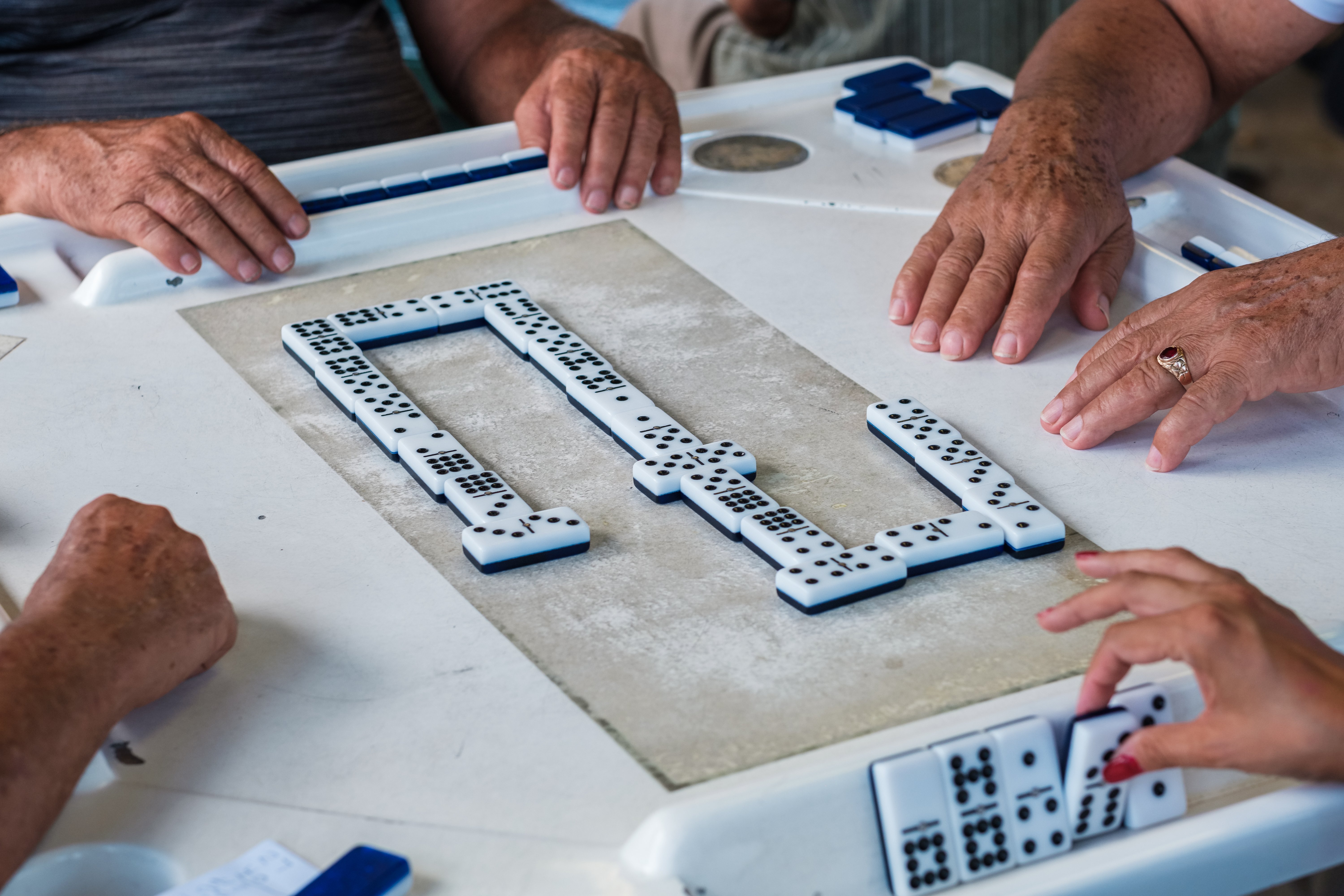 Residents playing a game of dominoes together