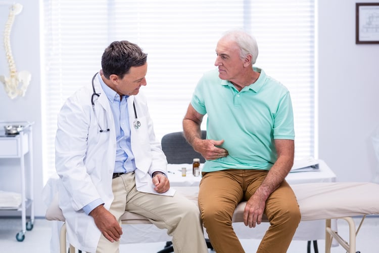 Senior adult in doctor's office explaining and experiencing malnutrition because of poor diet