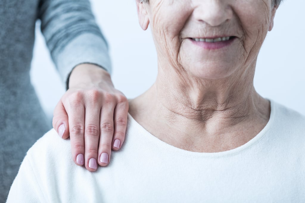 Caring for Senior with Alzheimer's.jpg Adult child caring for senior with alzheimers