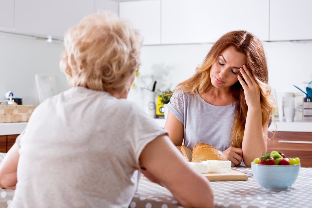 Adult Child caregiver with senior parent experiencing common causes of burnout