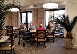A group of senior men enjoy a nutritious, made-to-order meal together at Highgate at Temecula assisted living community