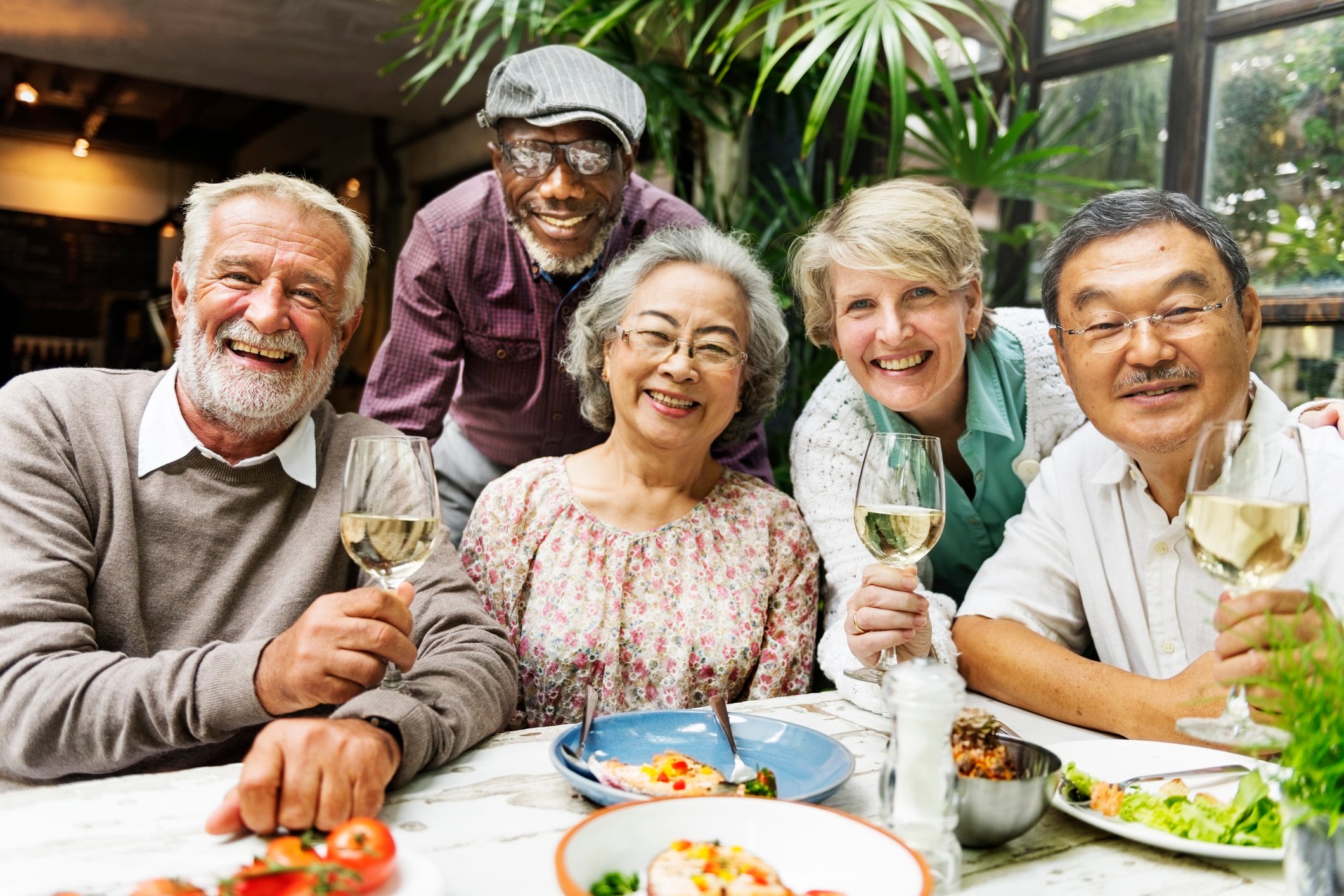 Friends gathering for a good meal and some wine