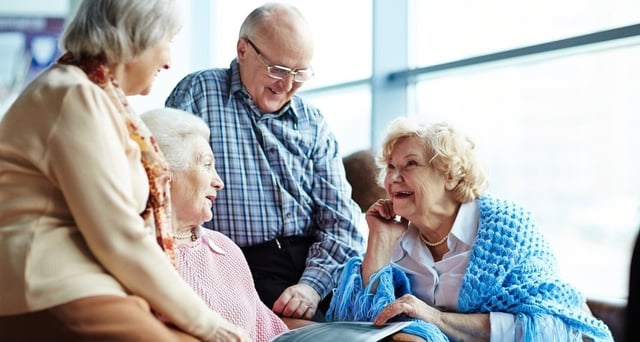 older adults discussing senior assisted living care options