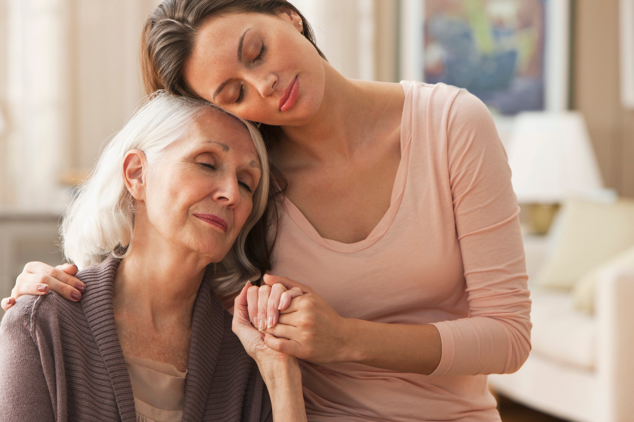 Daughter providing comfort to her mother