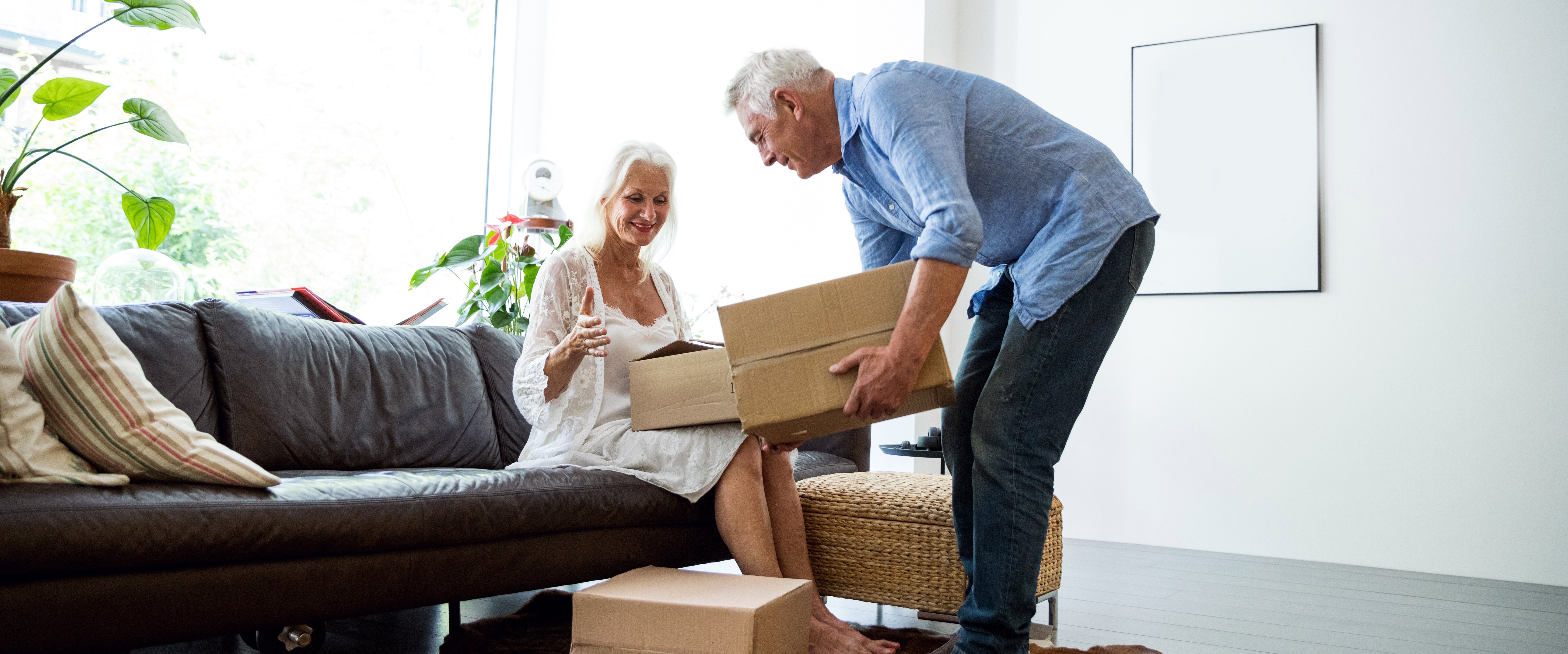 Couple going through boxes of their stuff together