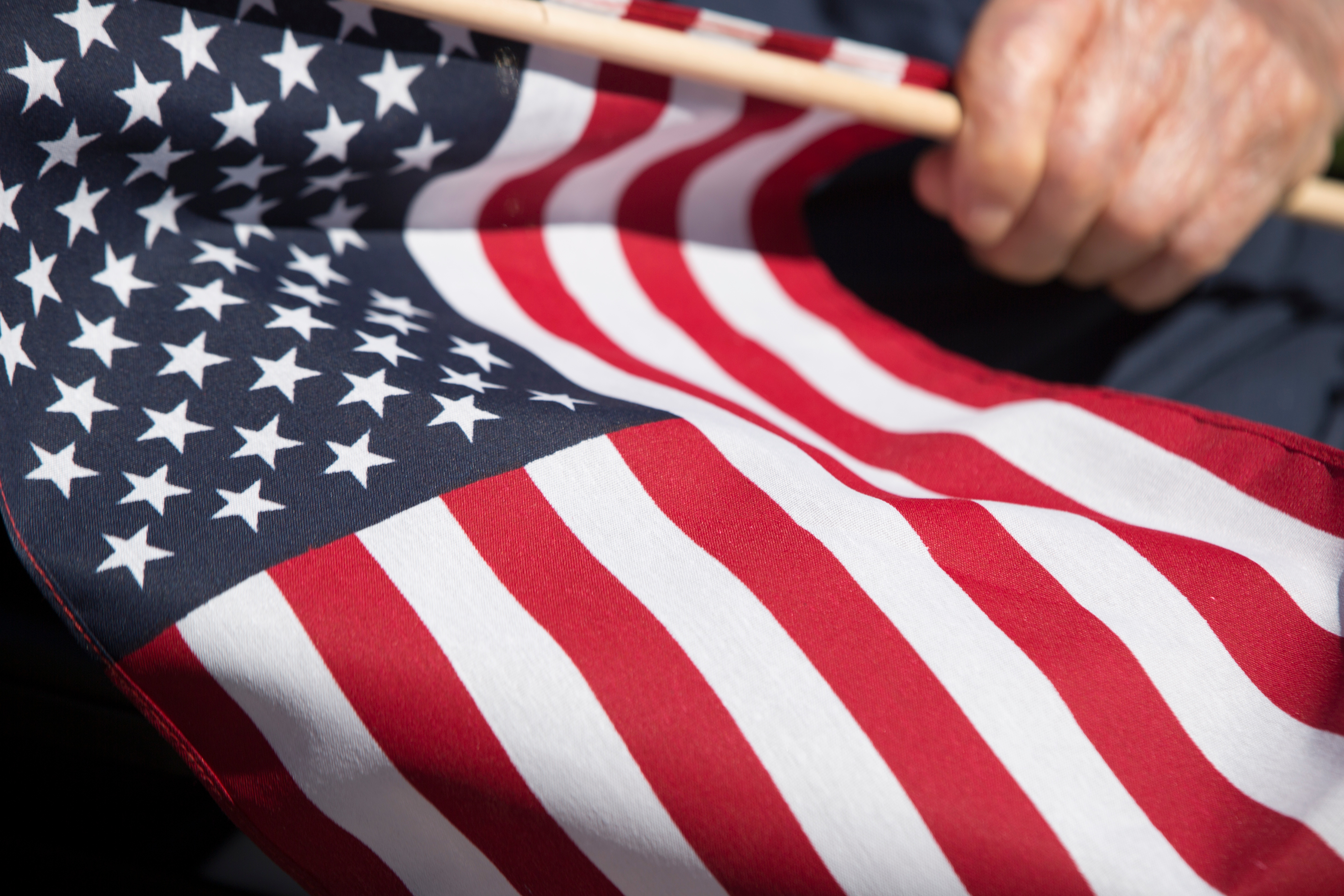 Veteran holding American flag